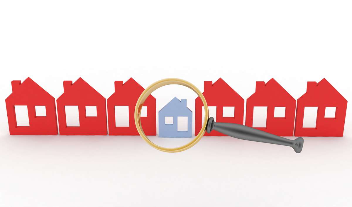 Magnifying glass selects or inspects a home in a row of houses (R) (S)